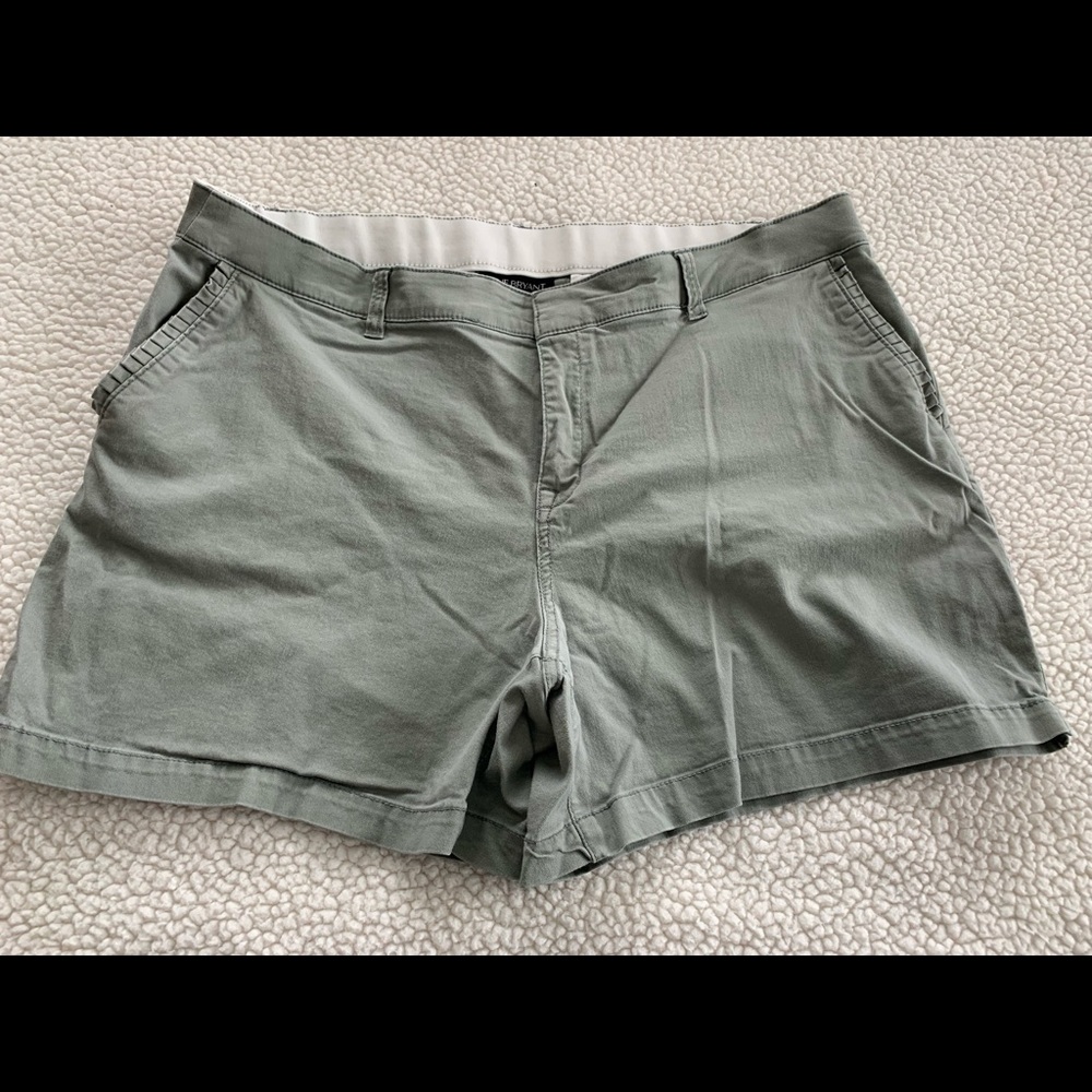 Olive green lane Bryant shorts with ruffle edging on pockets